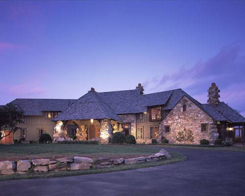 This majestic lodge-style house sits on the flat top of a mountain in North Carolina.